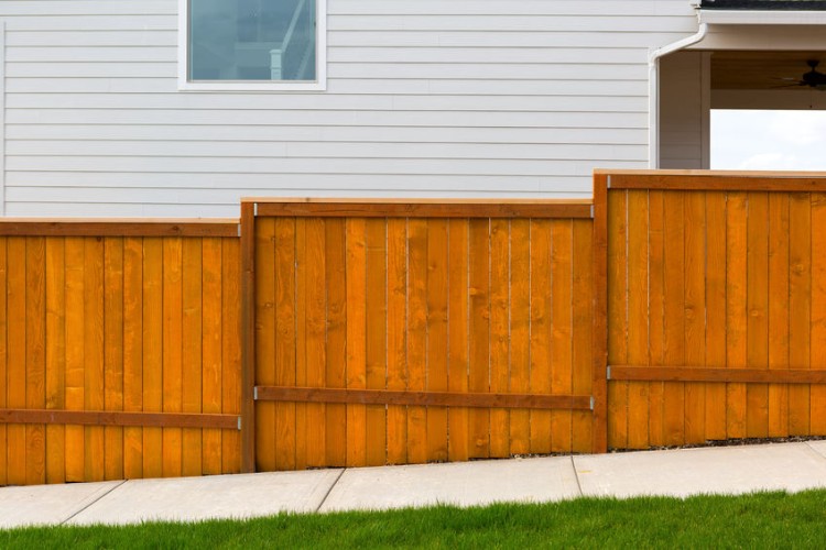 red stained cedar fence