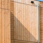 Composite cladding installed on the side of a building.